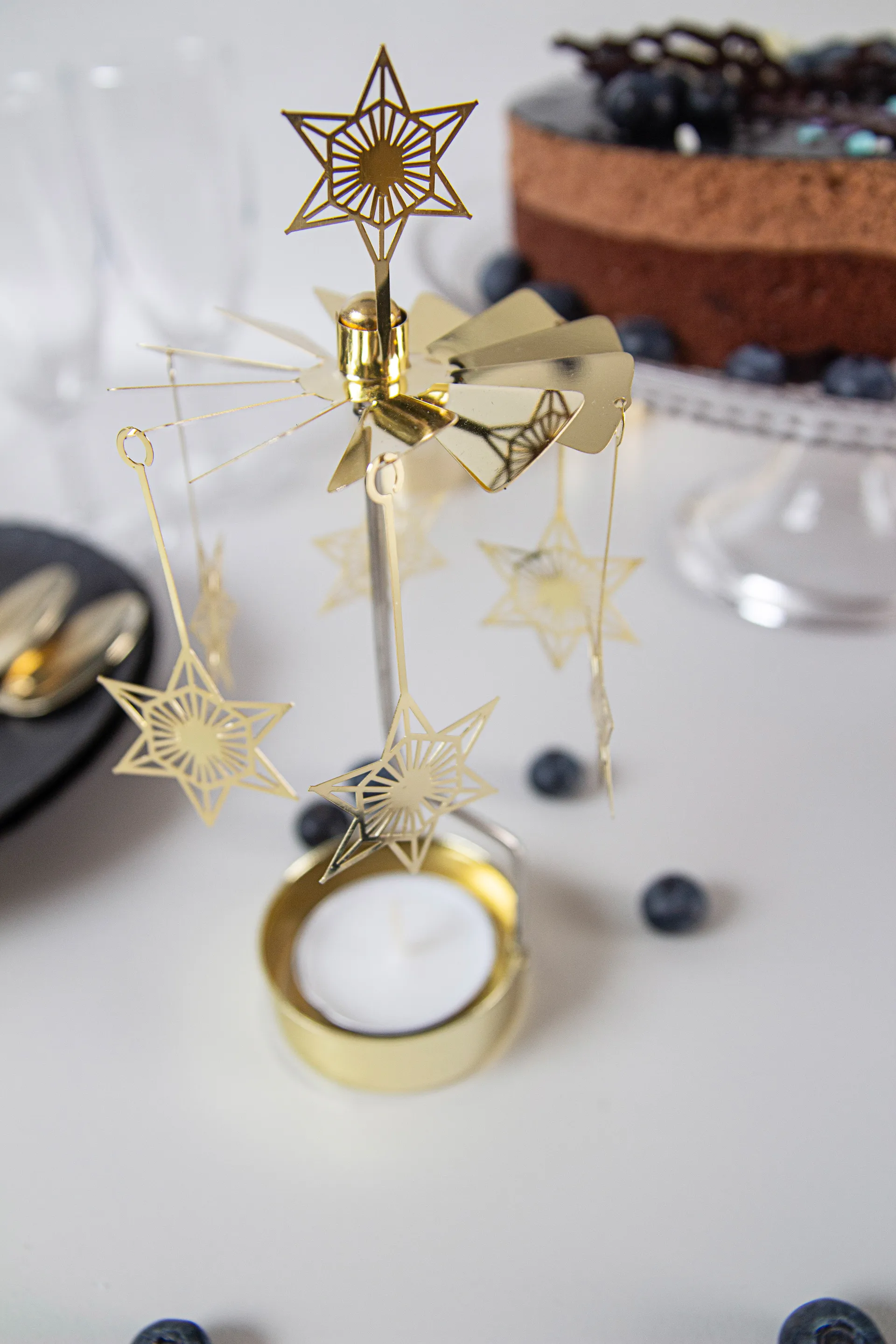 Giostrina portacandele a stella Art Deco, Oro Pluto Design