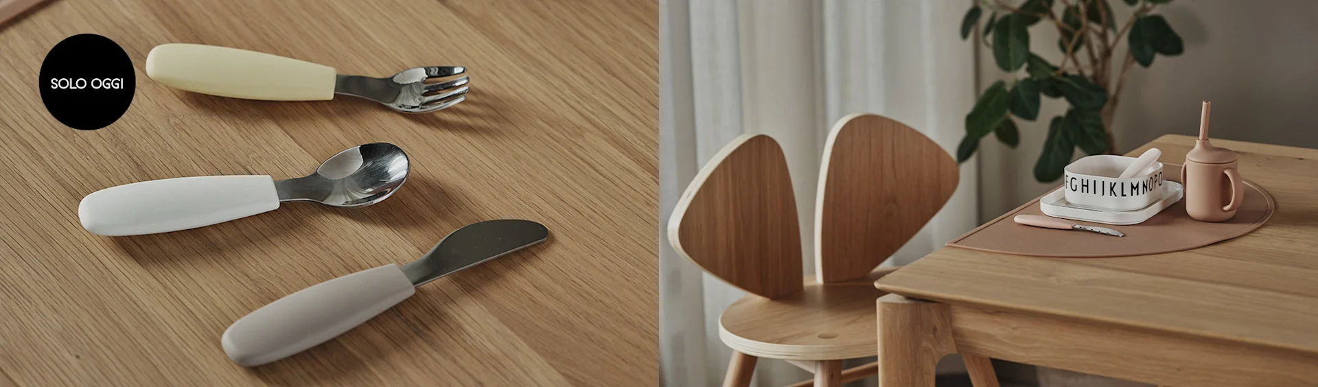 Posate per bambini con manici color pastello su tavolo di legno. A destra, un seggiolone e un set pappa con ciotola e tazza.