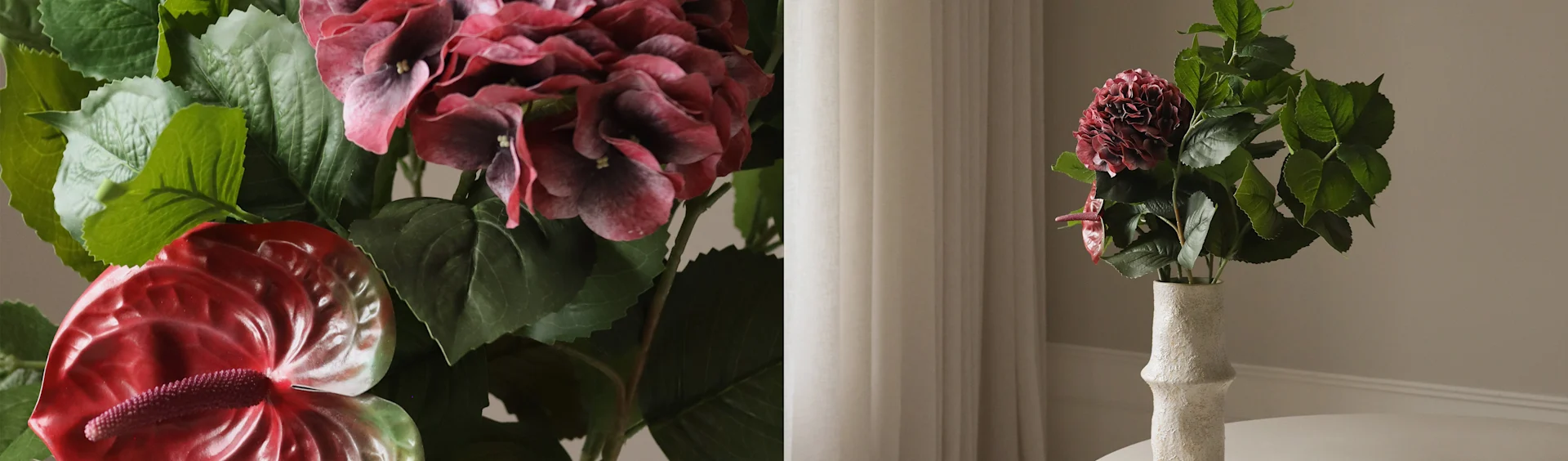 Ortensia rosso scuro e fiori di anthurium rossi artificiali in un vaso bianco testurizzato.